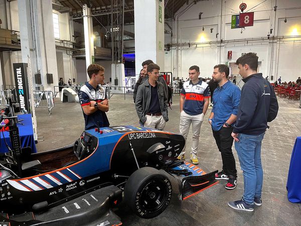 Explaining the technology behind the car to Nate Gentile